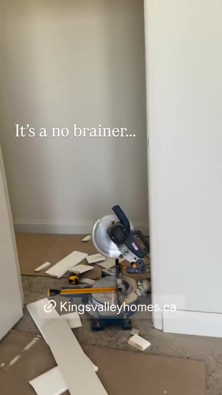 Worker finishing an interior wall