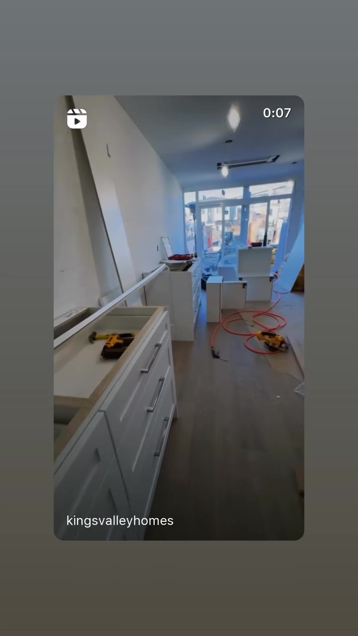 Light-coloured kitchen cabinetry during renovation