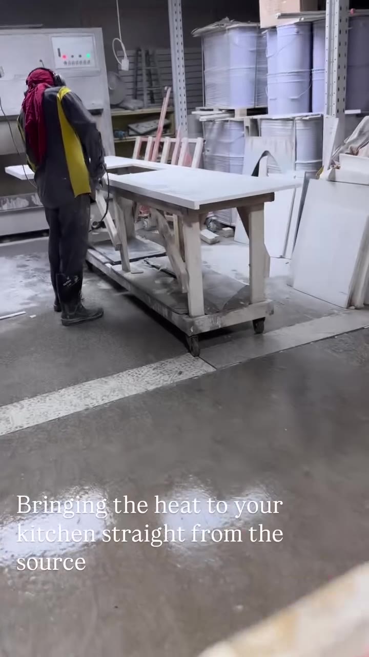 Installer working on kitchen cabinetry