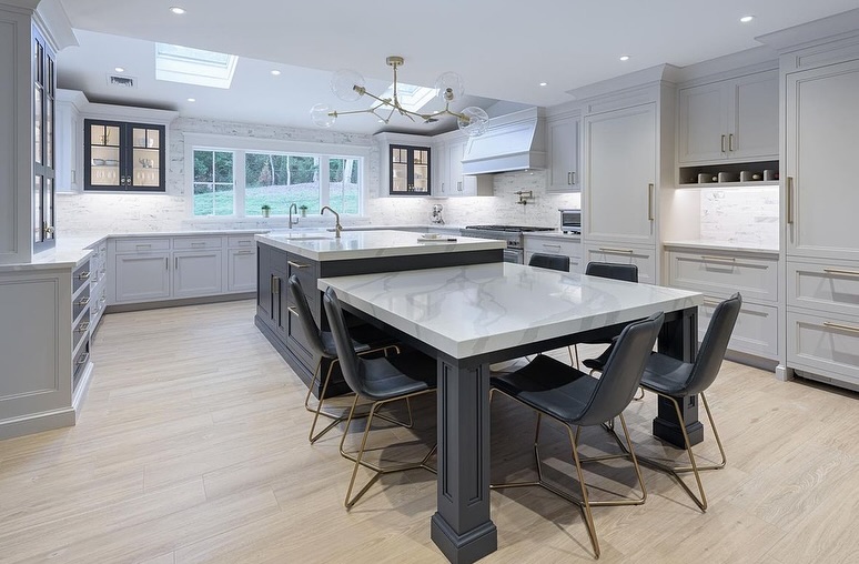 Spacious kitchen with two islands, skylights, and dining seating